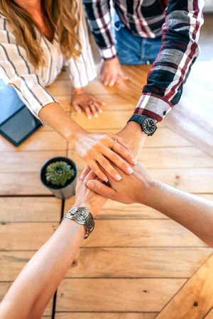 Businesspeople hands together in the office