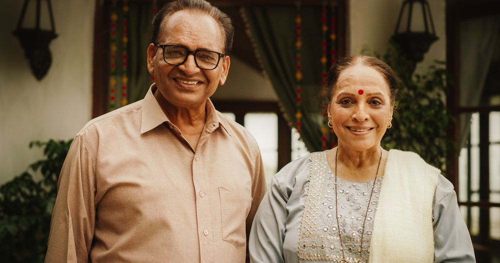 Portrait of Happy Indian Couple Posing Together at Their Authentic Mumbai Home.