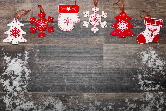Christmas background with ornaments on wooden board