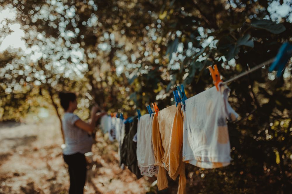 Woman hangs clothes to dry