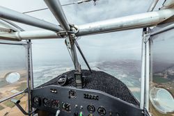 Aerial view from inside the cockpit of a small plane