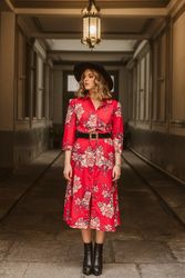 Elegant woman standing in old passage