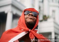 London, England, United Kingdom - August 28, 2022: Black man draped in Trinidad & Tobago flag 48zBj0