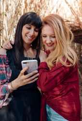 Young women looking in smartphone