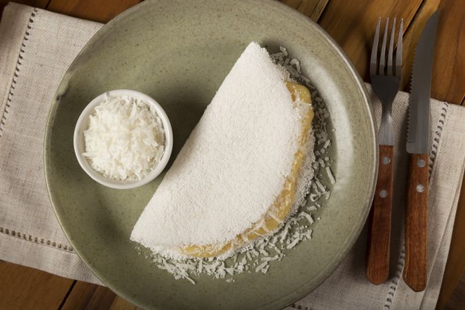 Sweet tapioca stuffed with coconut cream. Brazilian tapioca.