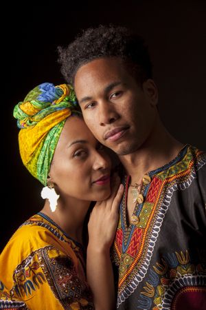 Black man smiling and looking away