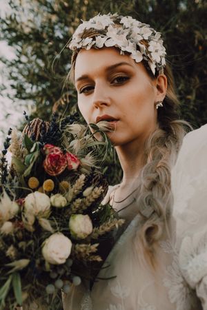 Woman in dress with flower bouquet