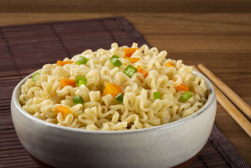 Bowl with instant noodles on the table.