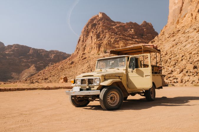 Off road truck near rocks in desert