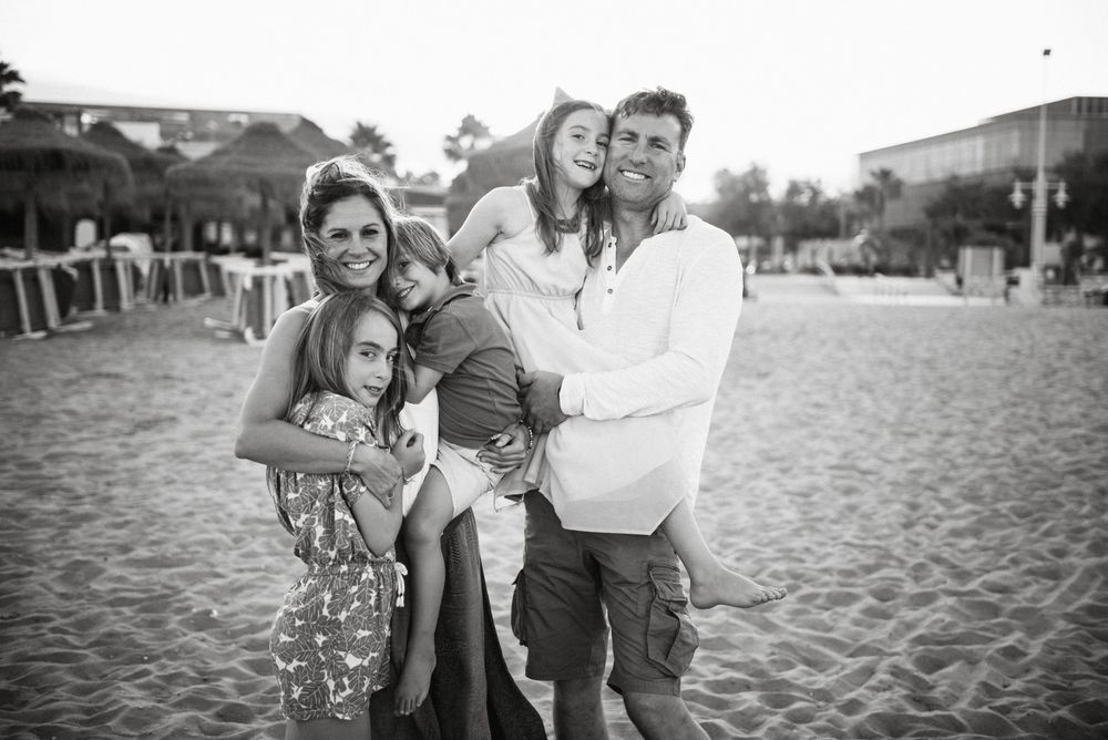 Beautiful happy family with children on beach