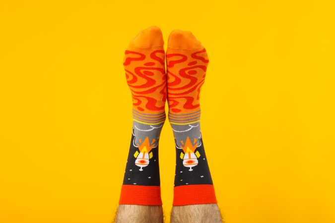 Concept of clothes for legs - socks, socks on male legs