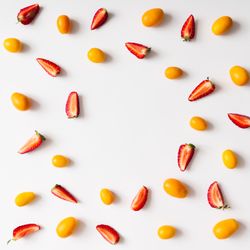 Pattern made of kumquats, strawberries