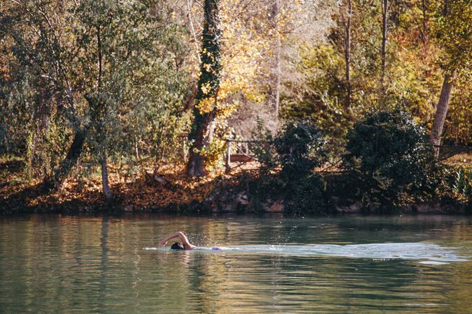 Woman swimming in lake