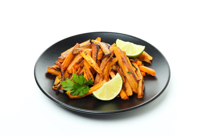Concept of tasty food - sweet potato fries, isolated on light background