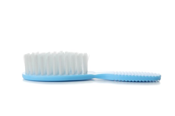 Baby brush isolated on light background. Hygiene