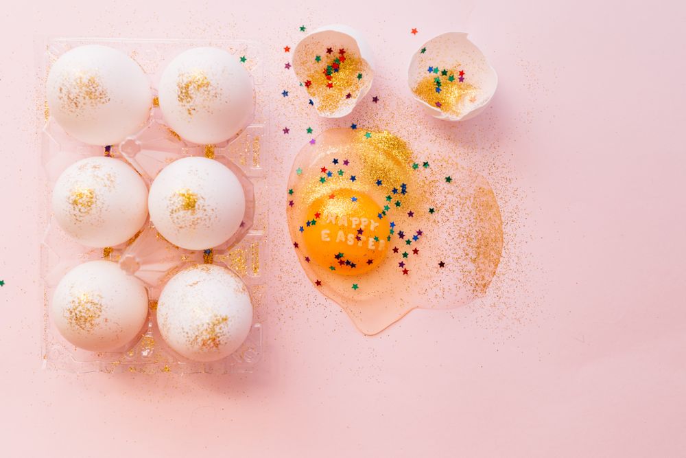 Decorated broken Easter egg on table