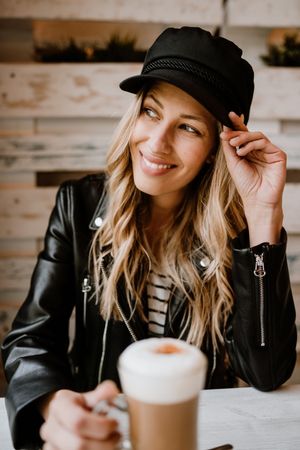 Woman drinking coffee from a glass