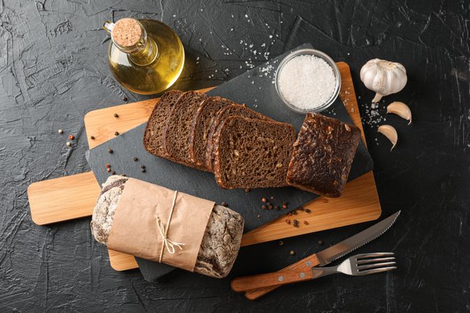 Composition with bread on cutting board, space for text and top view