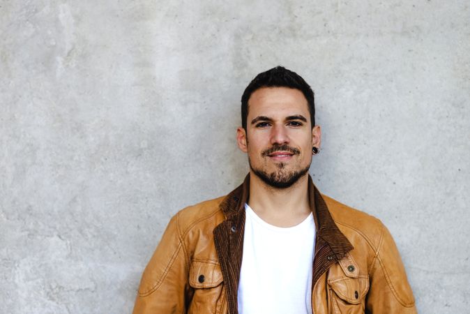 Stylish man outside modern building