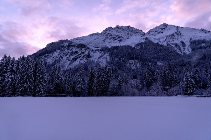 Winter scenery at sunset with snow-covered nature in the Bavarian Alps, Germany