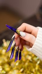 Glittering Purple Stiletto Nails