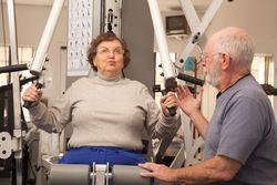 Mature Adult Couple Working Out Together in the Gym