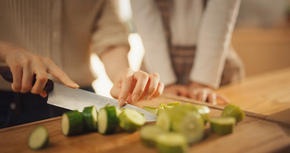 Portrait of Korean Woman and Daughter in the Kitchen Cooking Together.