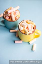 Two pastel mugs full of marshmallow 5lVEAV