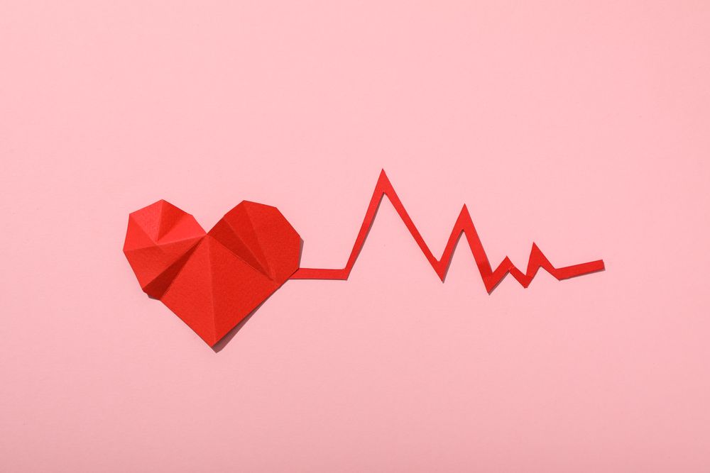 Heart with a cardiogram on a light background.
