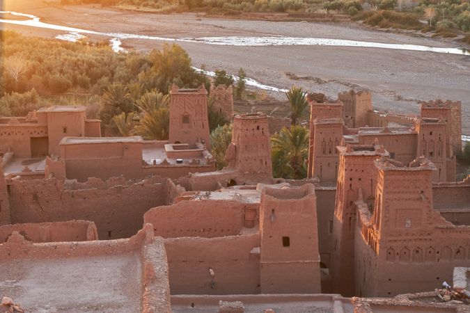 Ancient city near river in desert and wonderful sky