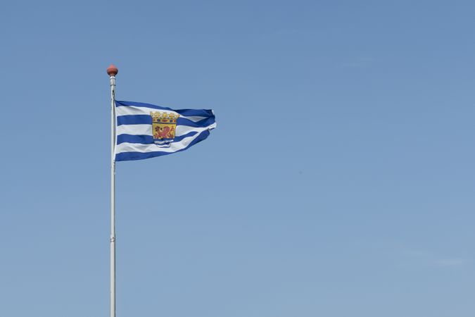Blue striped flag of Zeeeland a province in the Netherlands waving on a clear blue sky with space for copy
