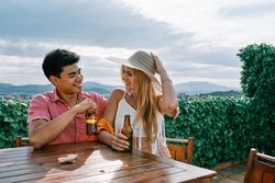 A woman and man in love drinking