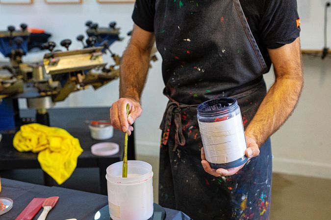 male artist preparing paints