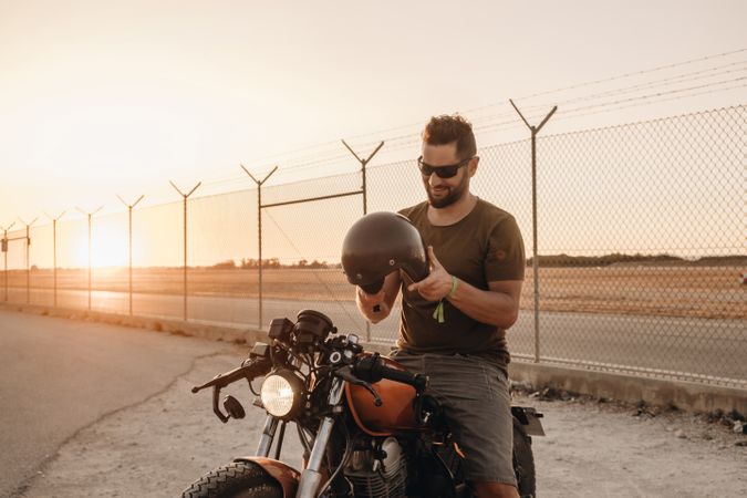 Strong man driving motorcycle
