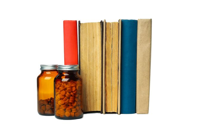Concept of different professional books - medicine books, isolated on light background