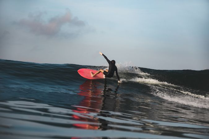 Man on surf board on waving water