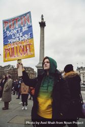 London, England, United Kingdom - March 5 2022: Woman in hoodie with anti-Putin sign 5aqPK5