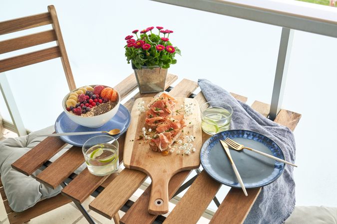 Appetizing breakfast on table on terrace
