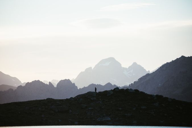 Majestic mountain landscape with human silhouette
