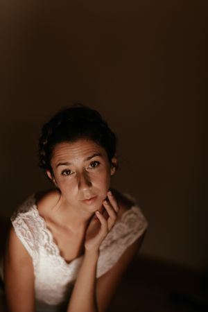 woman sitting in dark room