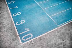 Detail shot of lane numbering on a track field