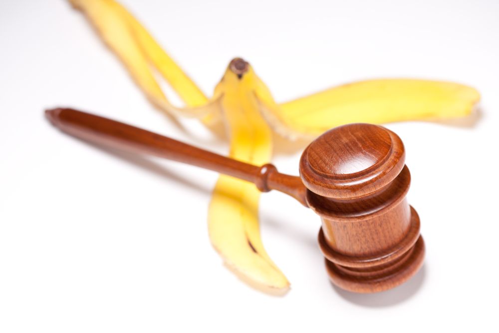 Gavel and Banana Peel on Gradated Background