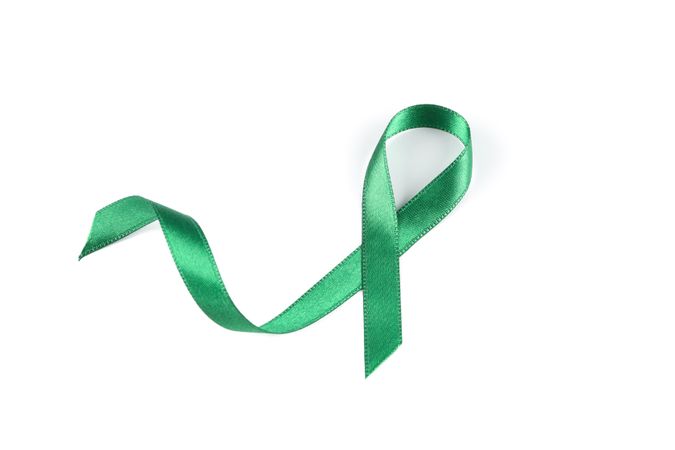 Green awareness ribbon isolated on blank background