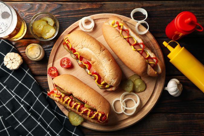 Composition with tasty hot dogs on wooden background