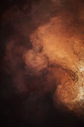 Smoke over water in brown light