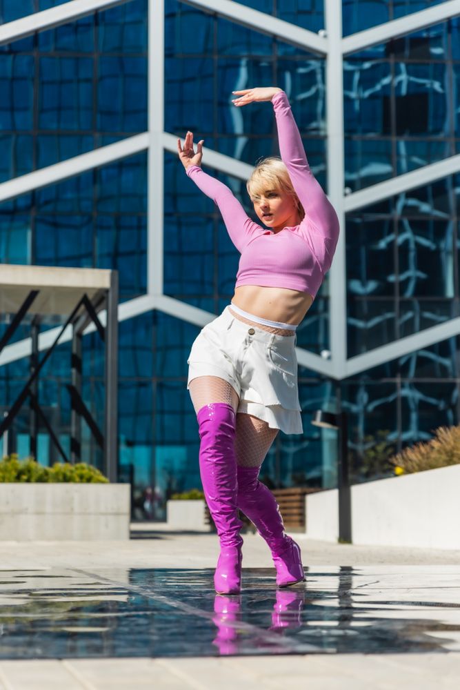Vertical Screen:  Stylish Young Woman Voguing On Street.