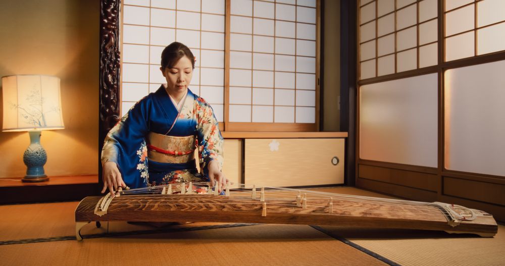 Portrait of a Talented Female Playing Koto Plucked String Instrument in Traditional Japanese Home.