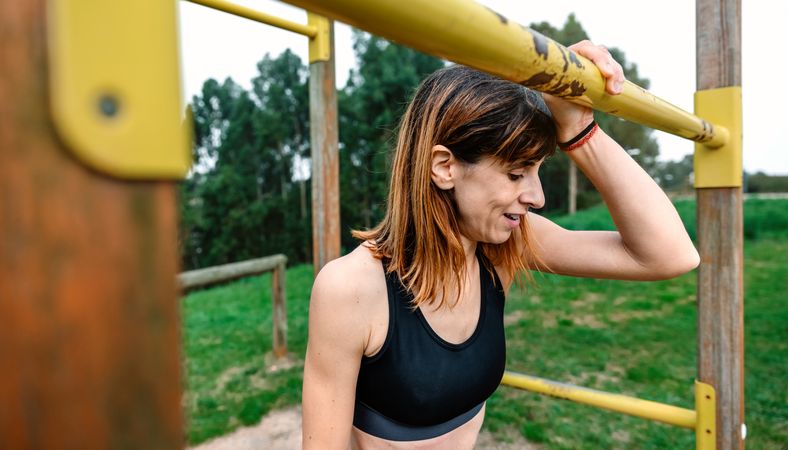 Tired athlete woman after training