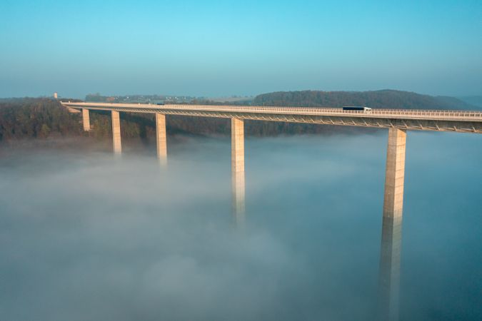 Majestic highway bridge in a foggy scenery, drone aerial view in Germany