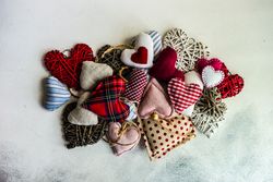 St. Valentines Day concept with top view of felt hearts on marble